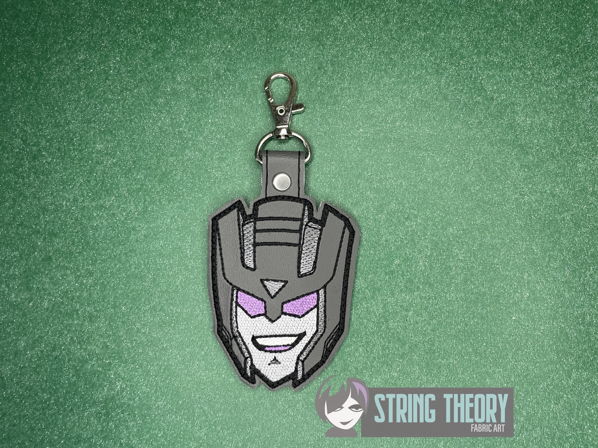 Transformers Swindle ITH fob machine embroidery design