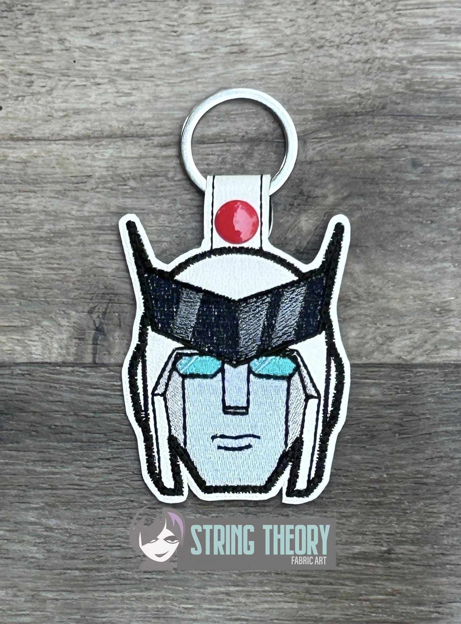 Transformers Ratchet ITH fob machine embroidery design