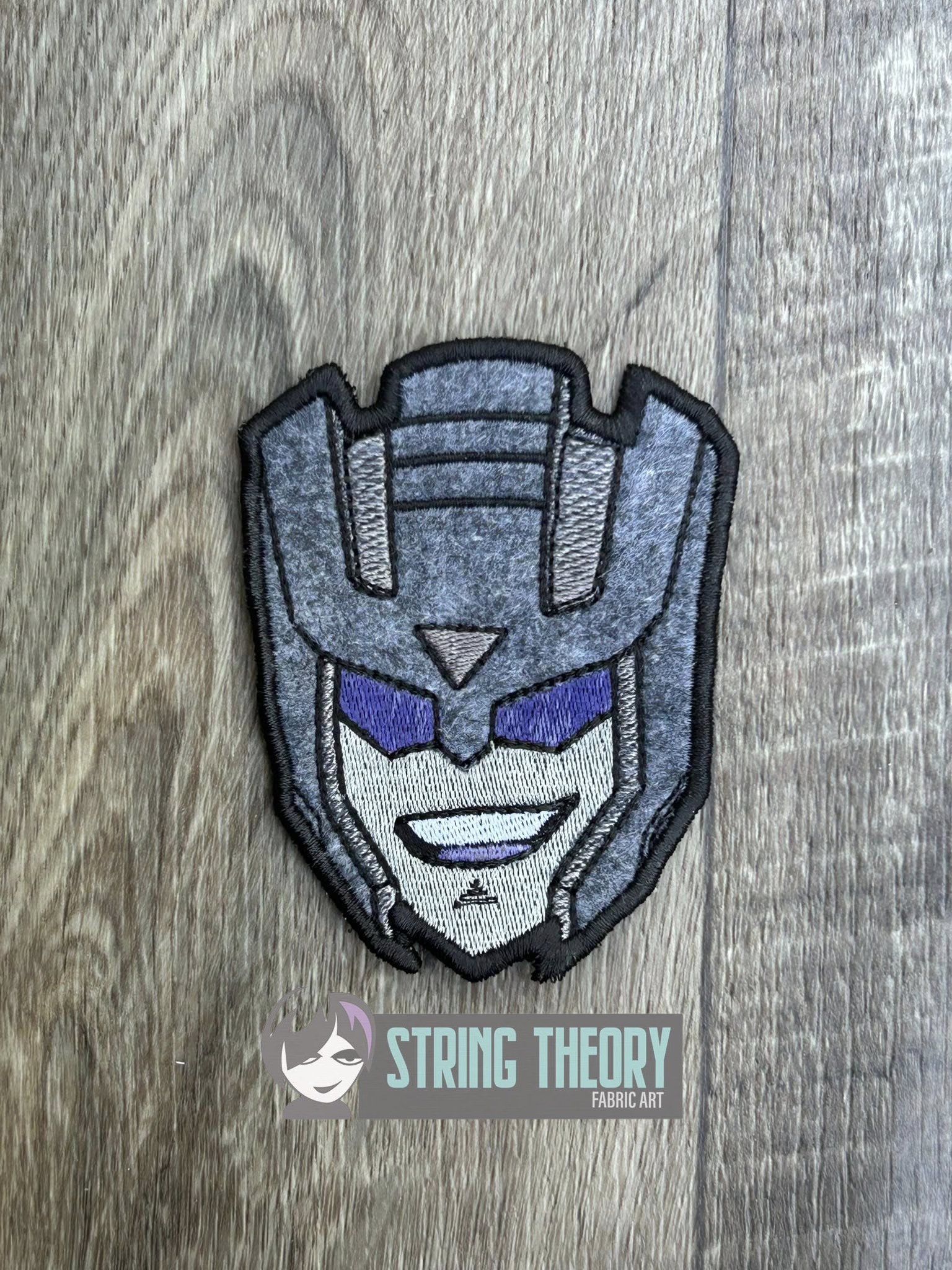 Transformers Swindle ITH patch machine embroidery design